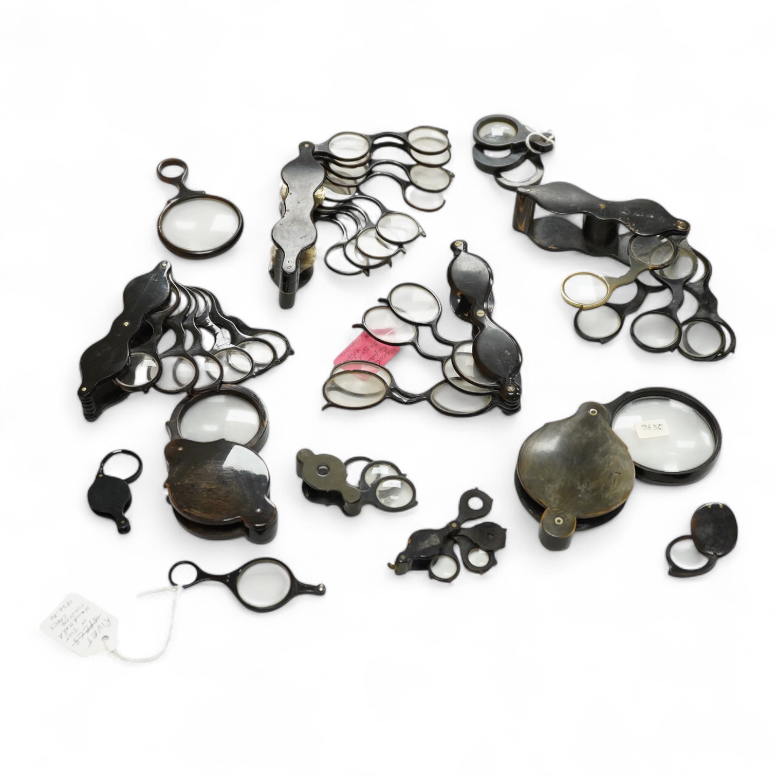A group of 19th-century horn framed loupes, quizzing glasses and four optician multiple lens sizing lorgnettes (13)